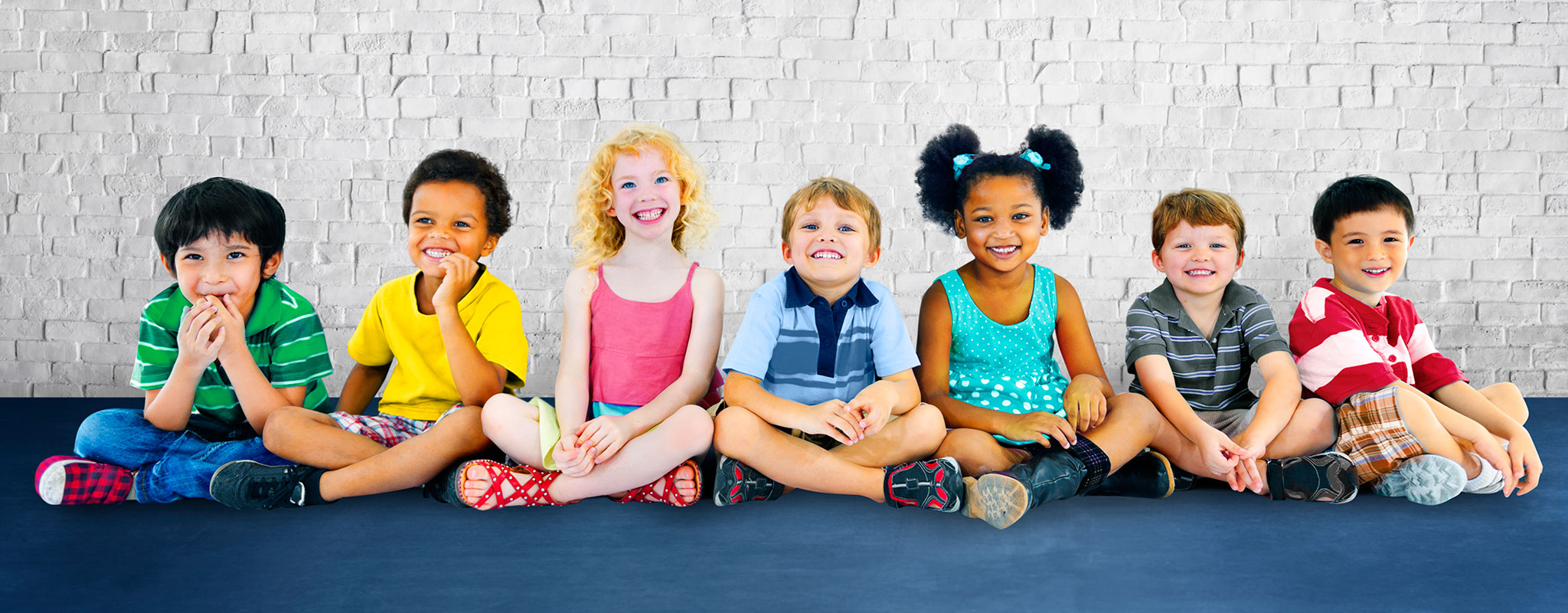 Group of kids sitting on floor Banner image for Gwinnett Pediatrics and Adolescent Medicine, Gwinnett Pediatricians